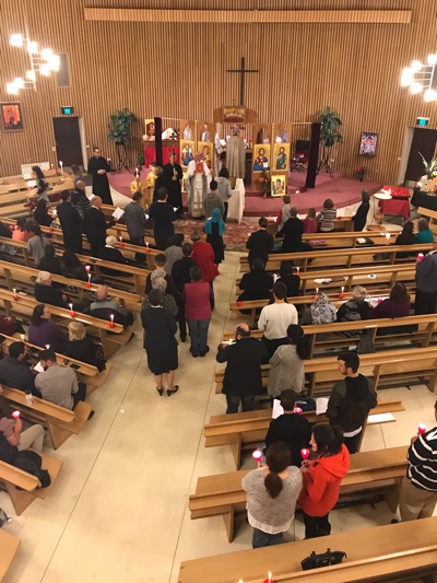 Congregation re-enters the brightly lit Church on Pascha
