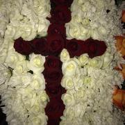 A cross formed by red and white flowers